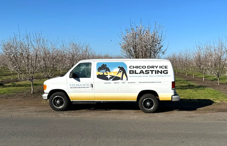 Chico Dry Ice Blasting service van parked on a rural road with branded company logo and contact information
